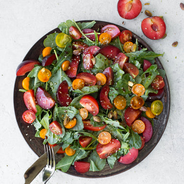 Juicy Plum & Tomato Salad with Pomegranate-Citrus Dressing