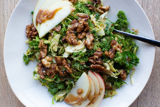 Shaved Brussels Salad with Date-Mustard Vinaigrette and Candied Date Syrup Walnuts
