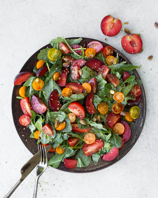 Juicy Plum & Tomato Salad with Pomegranate-Citrus Dressing