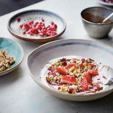 Fruit and yogurt with sesame oat crumble and tahini-date syrup